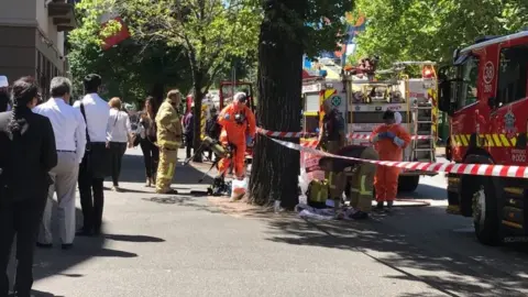 Reuters Emergency workers outside India and France's consulates in Melbourne