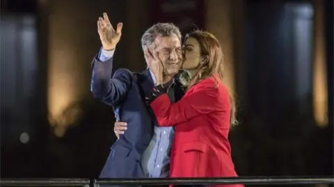 Getty Images Macri and wife