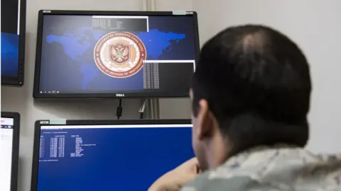 Spc. Craig Jensen US cyber command airman at work in Montenegro in 2018