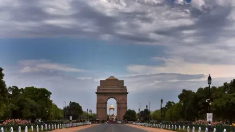 Getty Images Clouds hover over the blue sky at India Gate during the lockdown to limit the coronavirus on April 20, 2020 in New Delhi, India.