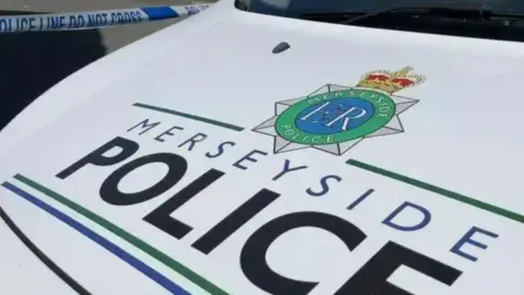 PA Media A close up photo of a Merseyside Police car bonnet