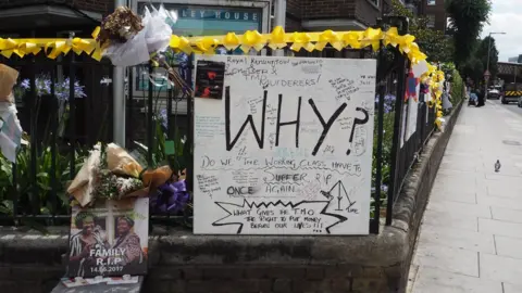 BBC A poster asking 'Why?' near Grenfell Tower