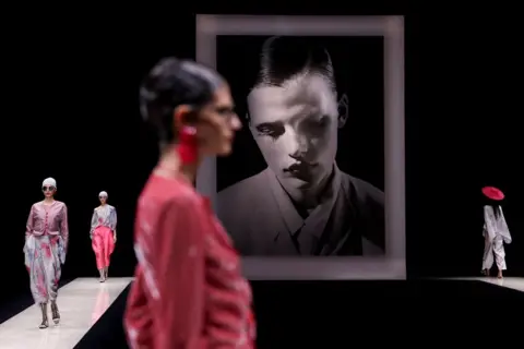 Claudia Greco/Reuters Models present creations from the Emporio Armani Spring/Summer 2025 collection during Fashion Week in Milan, Italy, September 19, 2024. 