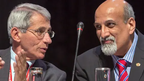 Getty Images Anthony Fauci (L) and Salim Abdool Karim (R) at an HIV conference in Durban in July 2016