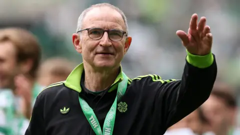 Martin O'Neill smiles after winning the Scottish Premiership