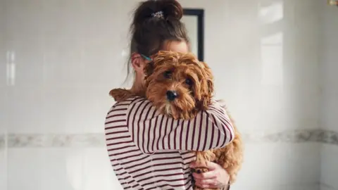 Getty Images File photo of dog and owner