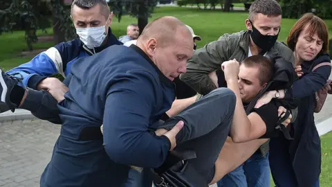 Getty Images Security agents detain opposition supporters