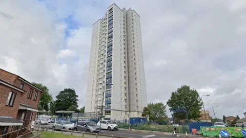 Google Image of the 20-storey grey and blue tower block where one of Mr Jones' flats is