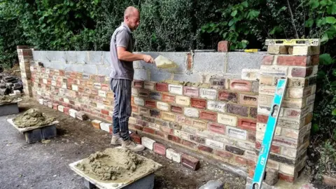 Val Scully Mark Tilney laying the heritage wall at Path Head Water Mill