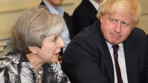 PA Theresa May and Boris Johnson