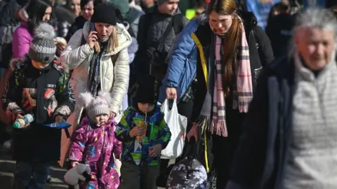 Getty Images Refugees at Polish border