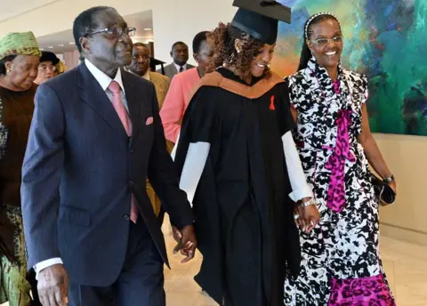 AFP Zimbabwe's President Robert Mugabe (L) and his wife Grace (R) with first-born child and only daughter Bona Mugabe (C) leaving a graduation ceremony at MDIS-University of Wales graduation ceremony in Singapore - 16 November 2013