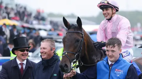 Getty Images Ronan Whelan celebrates riding Christmas Day to victory in The Betfred Derby