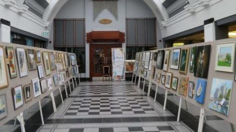 The Villa Marina Arcade with artwork exhibited on either side