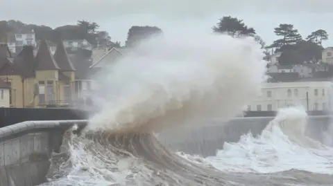 Richard Heiron Waves are seen hitting the sea wall in Dawlish.