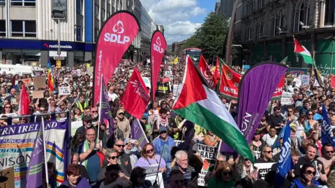 BBC Crowds of campaigners lining the street in front of Belfast City Hall 