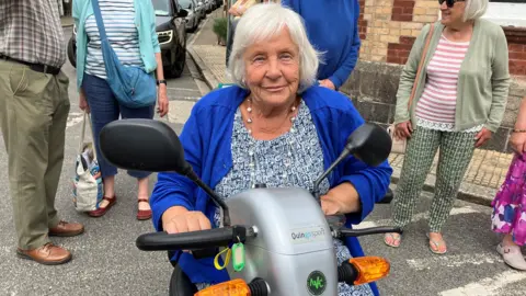 Lady on mobility scooter 