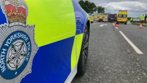 Police attend the scene of a collision on the A19