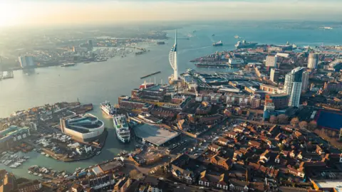 Aerial view of portsmouth, a port city and naval base on england's south coast, featuring the iconic spinnaker tower