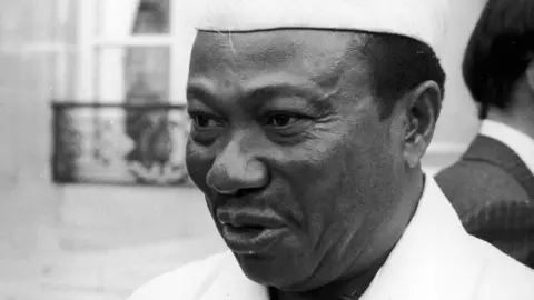 A black and white, head and shoulders image of William Tolbert. 