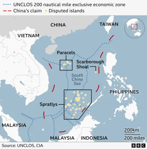 China seizes 60,000 maps over 'mislabelled' Taiwan Map of the South China Sea showing territorial claims and disputed areas. It includes China's claim line in red dashes, the UNCLOS 200-nautical-mile exclusive economic zones in blue dashes, and disputed islands marked with yellow dots. Key locations labelled include the Paracels, Scarborough Shoal, and Spratlys. Vietnam, Malaysia, Indonesia, the Philippines, Taiwan and China are also labelled. Source: UNCLOS and CIA.