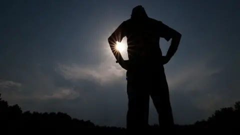 A player is standing alert during a cricket match on a hot summer day in Sopore District, Baramulla, Jammu and Kashmir, India, on May 30, 2024. (Pho