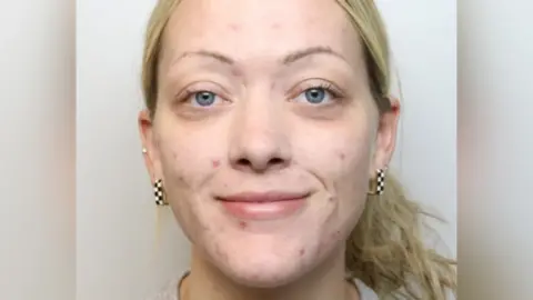 Wiltshire Police Mugshot of Ellie Watson, who has tied back her blonde hair and is smiling.