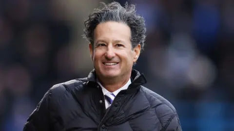 Brad Galinson smiles broadly on match-day at Gillingham