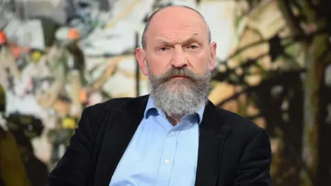 Chris O'Shea, chief executive of Centrica which owns British Gas, faces the camera wearing a dark suit jacket and light blue shirt