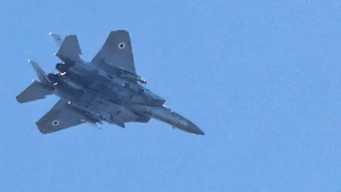 Getty Images An Israeli Air Force F-15 Eagle fighter aircraft flies over Haifa on September 24