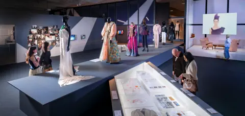 Grant Anderson People observing the runway room in V&A Dundee's new Catwalk exhibition.