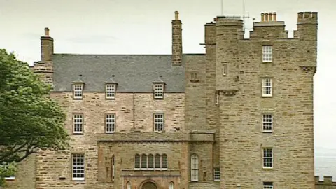 The Castle of Mey with a tree in the foreground