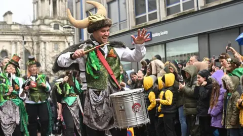 PACEMAKER Crowds gathered to watch the parade in Belfast city centre