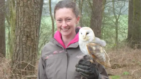 Gemma Gemma with an owl on her gloved hand