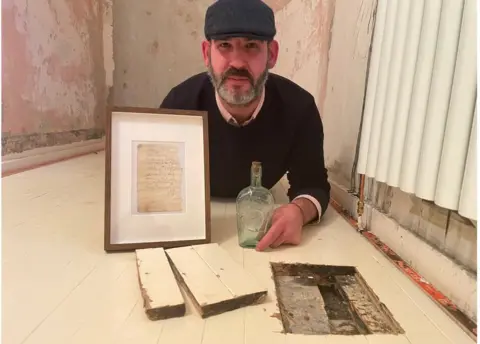 Plumber finds 135-year-old note inside whisky bottle under floorboards of  Scotland home