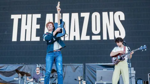 Getty Images Matt Thomson and Elliot Briggs of The Amazons and Toby Patridge perform at Ippodromo SNAI La Maura during the I-Days Festival