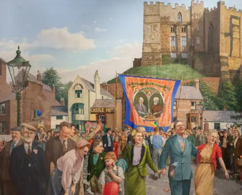 John Bird/Durham Miners' Association/House of Hues Painting of people on a bridge in Durham holding a banner with shops and the castle behind