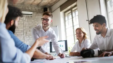 Getty Images Creative young business people working on business project in office