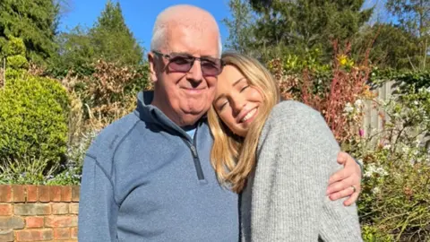 Family photo Skydive pair Freya and Graham hugging