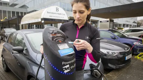 Getty Images Charging electric car