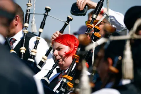 Getty Images A piper giving it her all