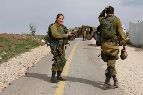 AFP Israeli soldiers block a road in the Israeli-annexed Golan Heights, 10 February 2018