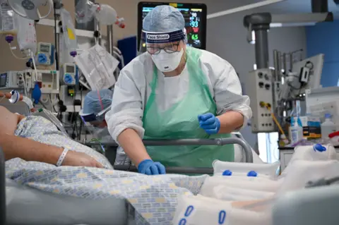 Getty Images Staff attending to Covid patient