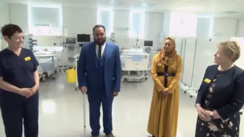 Buckingham Palace Asef Hussain and his wife Shamina talk to the Queen in a video call