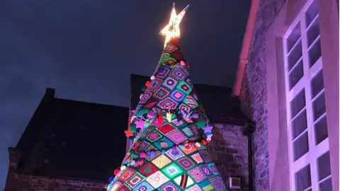 Giant knitted Christmas tree, lit up