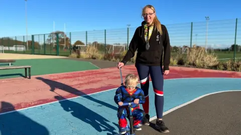 Lauren Jane Carter/BBC Arlo and his mum Amber Fox-Hammond at the park