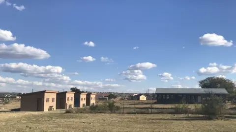 Newly built flush toilets can be seen at Michael’s old school. The pit toilets are less then a metre from there and have since been destroyed and filled-up.