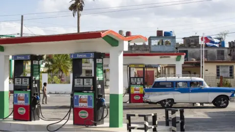 Getty Images A vehicle fuels up at a gas station in Matanzas, Cuba