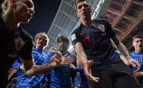 AFP/Getty Images Mandzukic holding out his hand