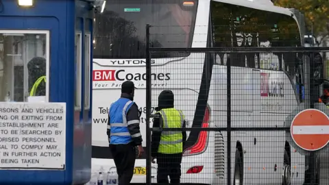 PA Media A coach arriving at the Manston processing centre in Kent this week